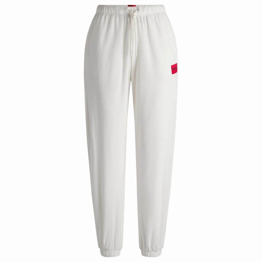 Tracksuit bottoms with red logo label Anti Pill Surface